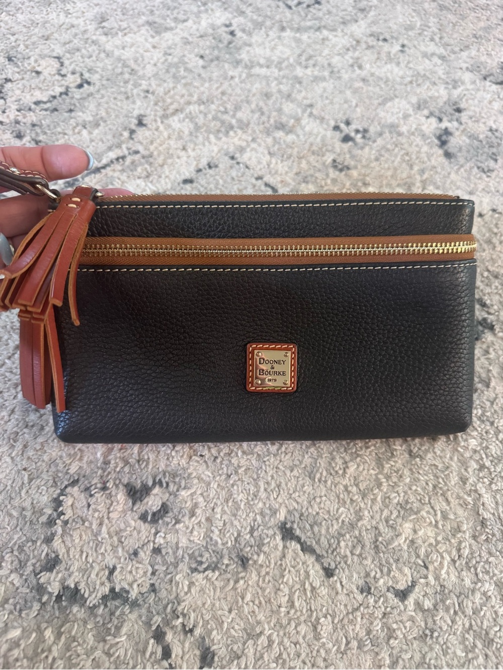 Dooney & Bourke black Pebbled Leather Wristlet with Tan Trim and Tassels